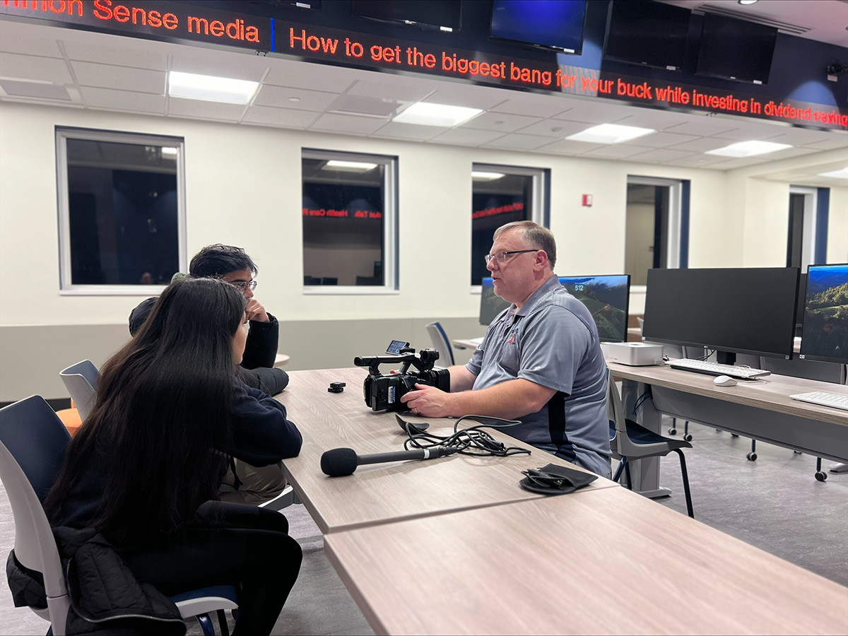 Frank Center student workshop in Frank Newsroom on field camera