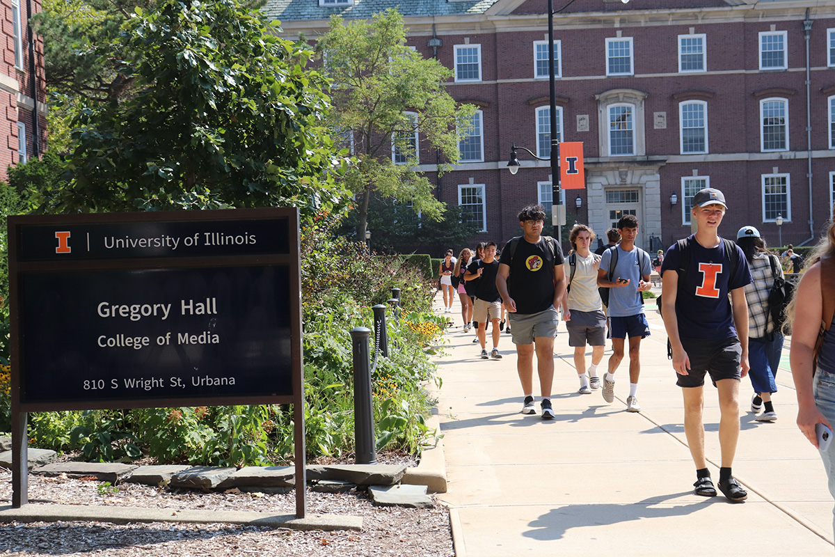 Students walking outside Gregory Hall