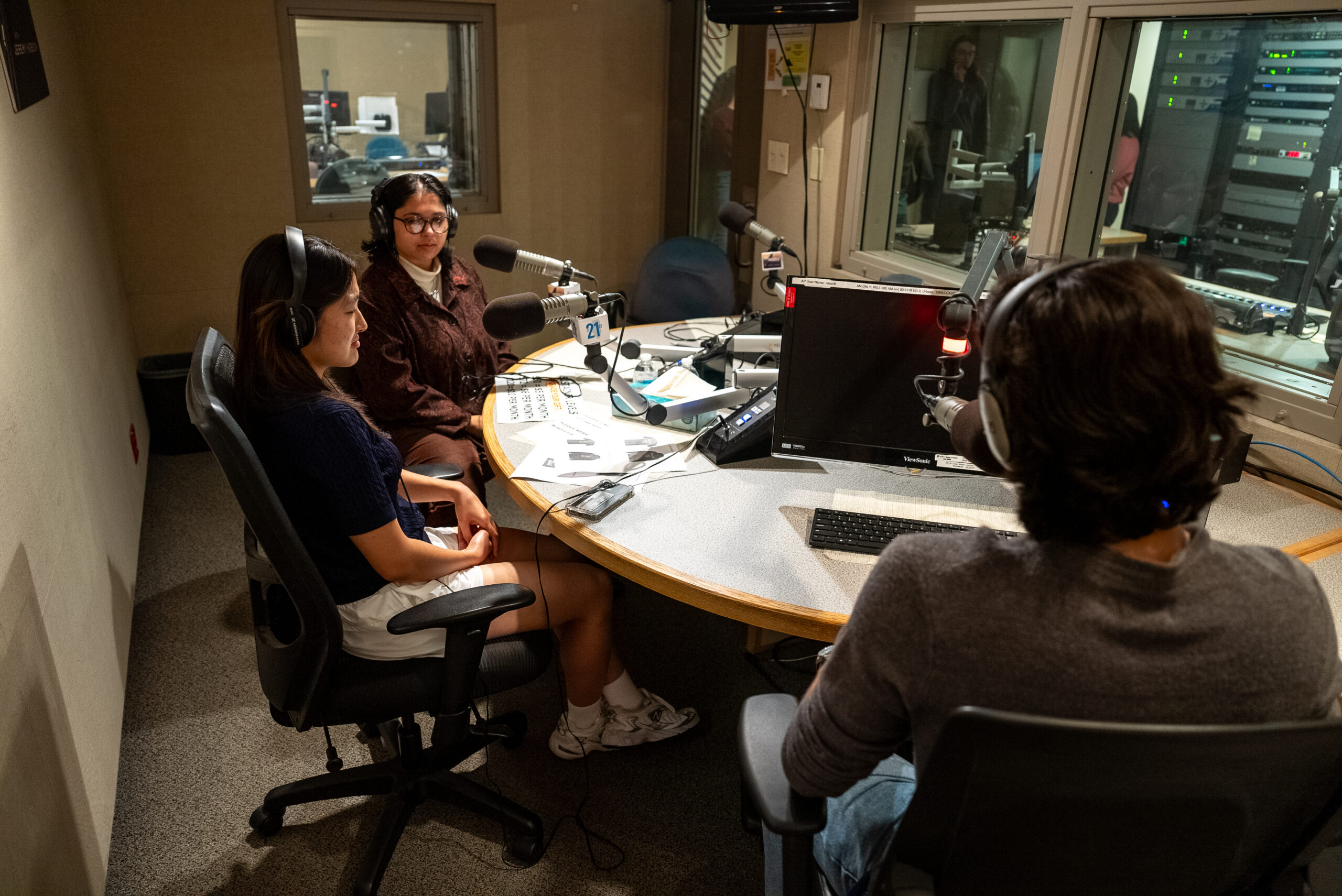 Students in Illinois Student Newsroom at IPM audio booth