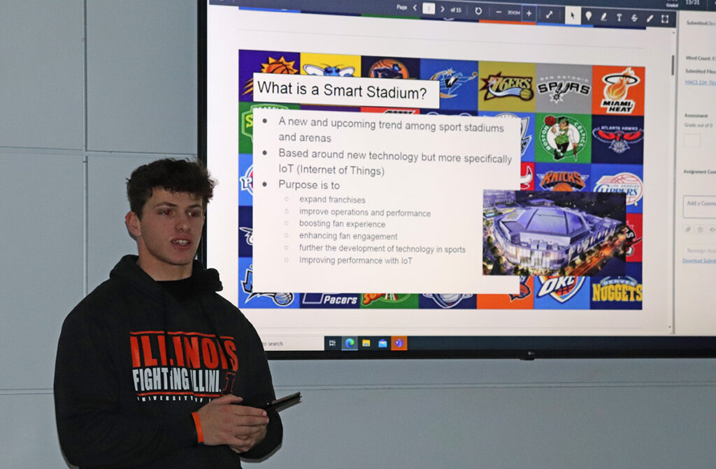 Student in SportMedia class presenting on smart stadiums