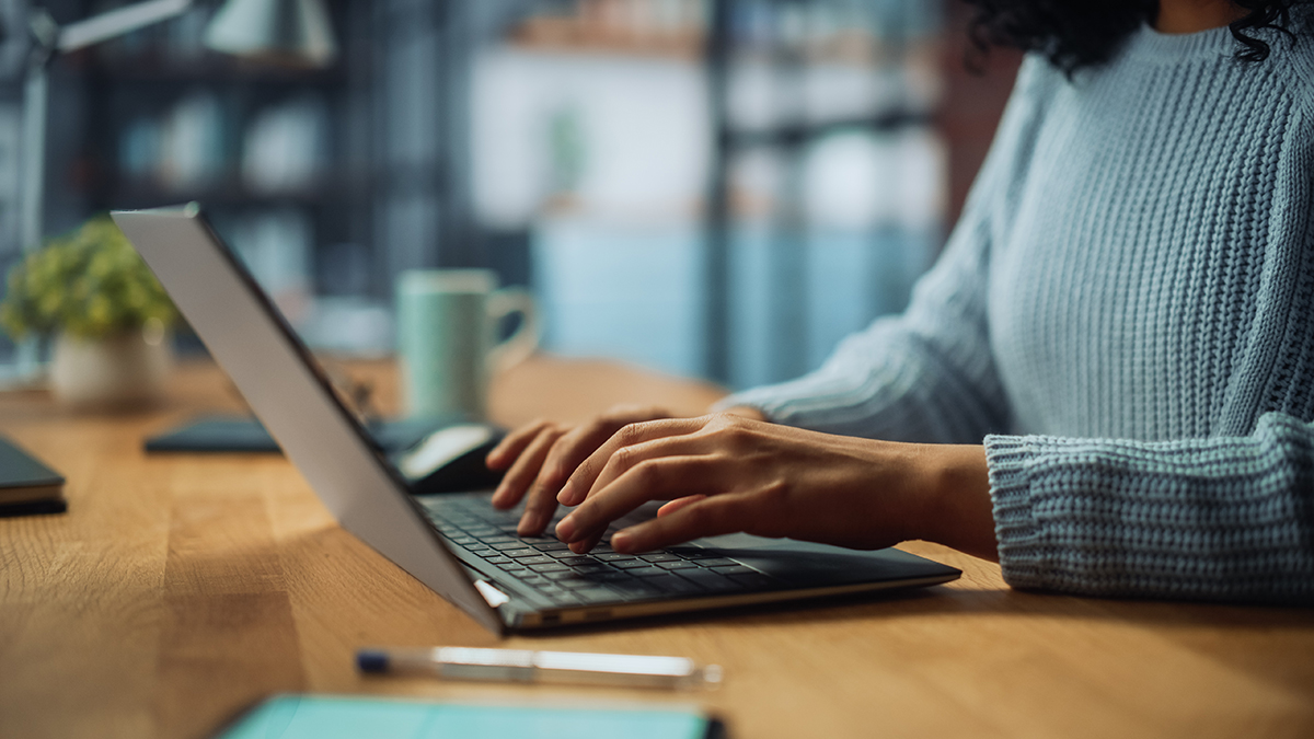 Person typing on laptop