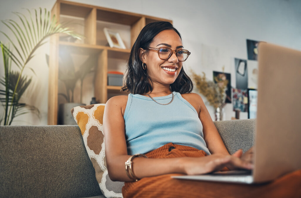 Woman working on laptop at home