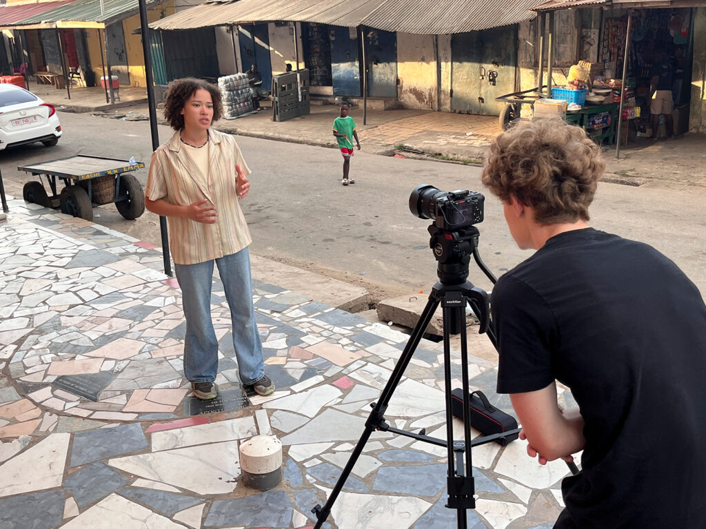 Kaitlyn on camera in Ghana
